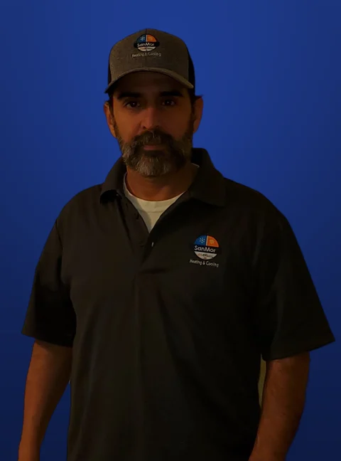 Sanmor HVAC Solutions technician wearing a Sanmor cap and uniform shirt